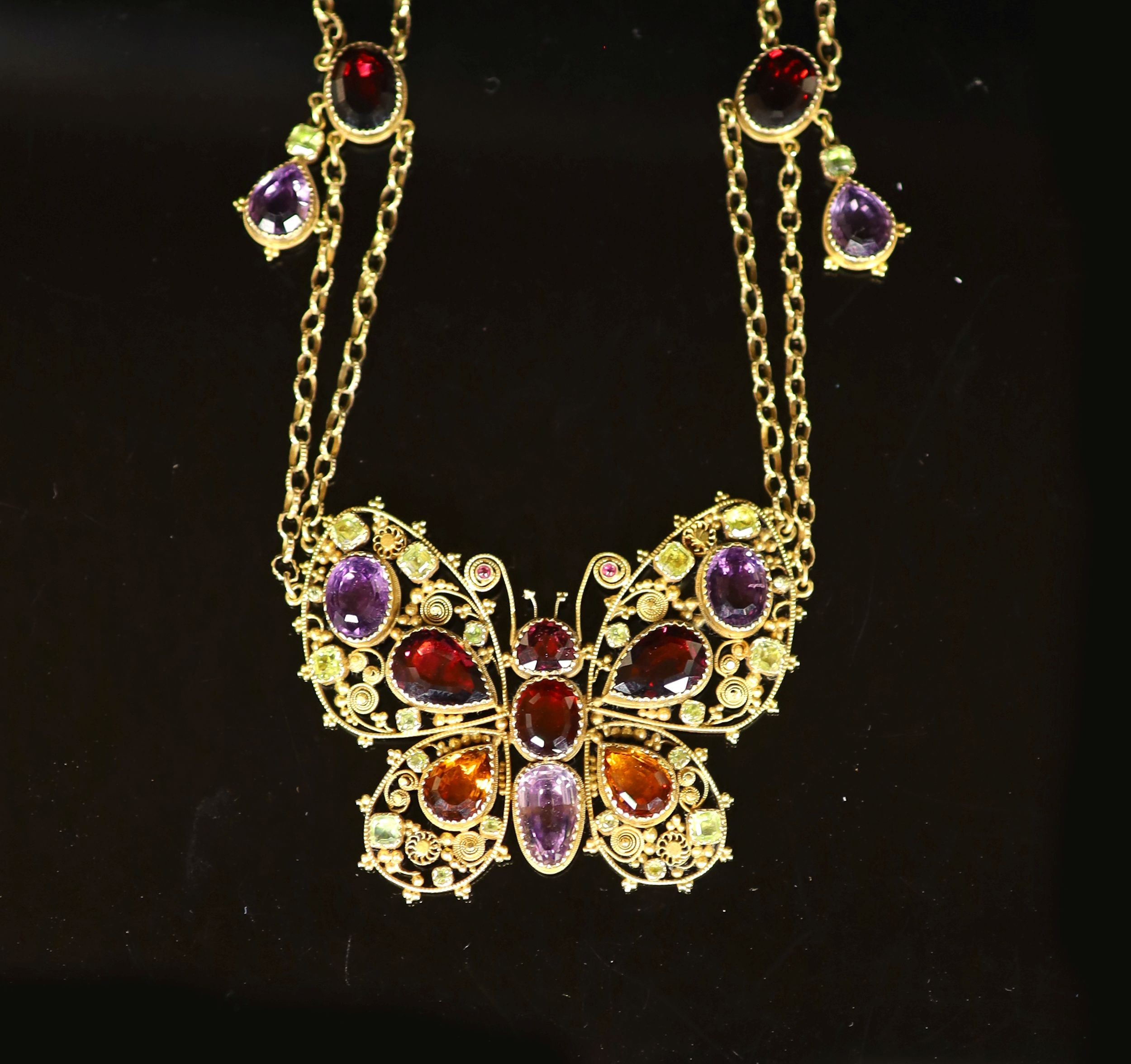 A 19th century gold and multi gem set twin strand necklace, with pendant modelled as a butterfly